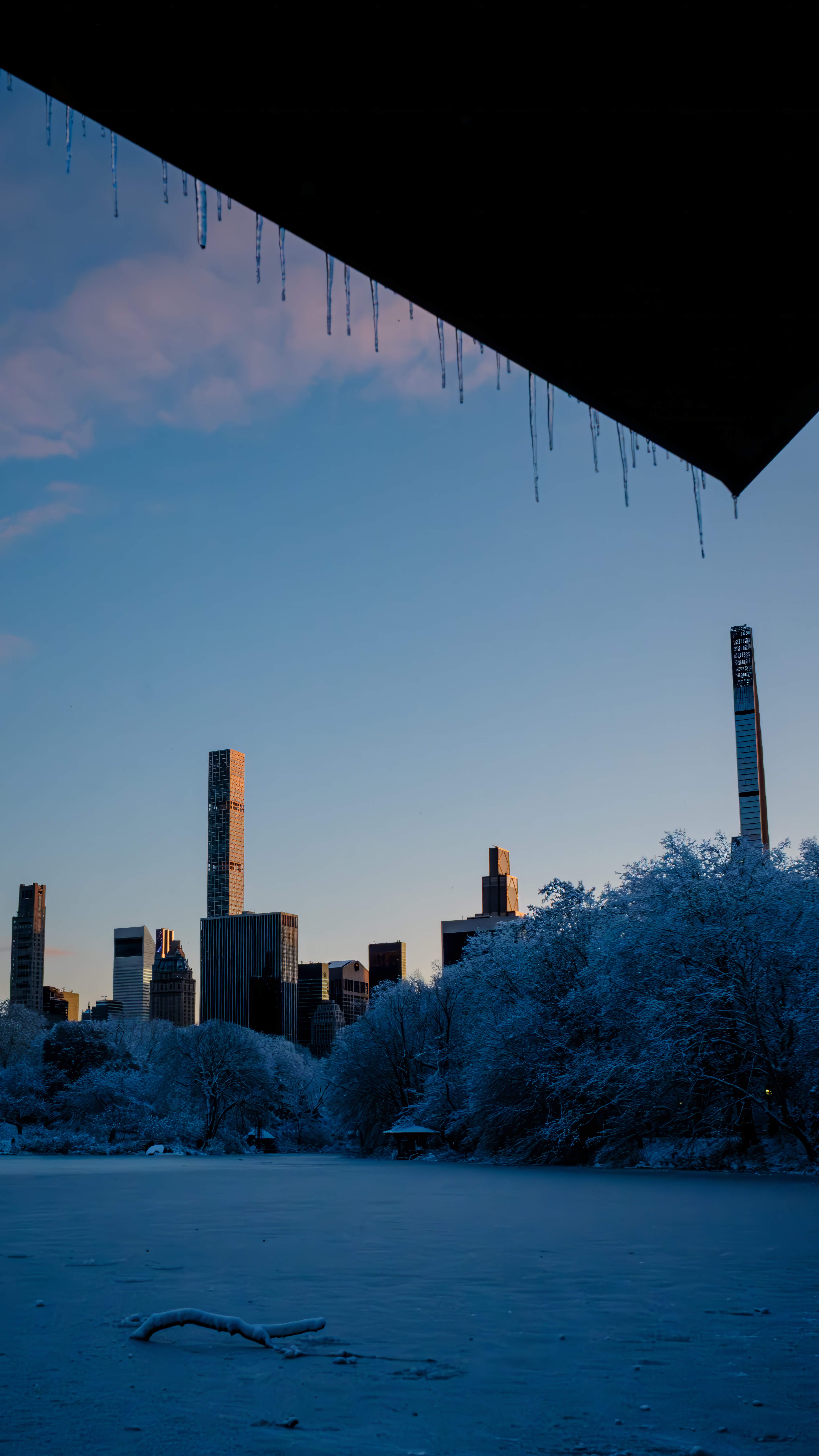 Manhattan skyline framed by icicles